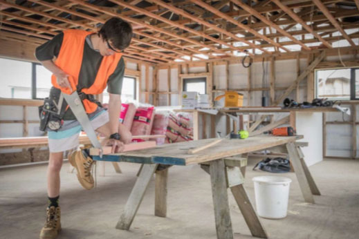 Carpentry student working on a timber frame